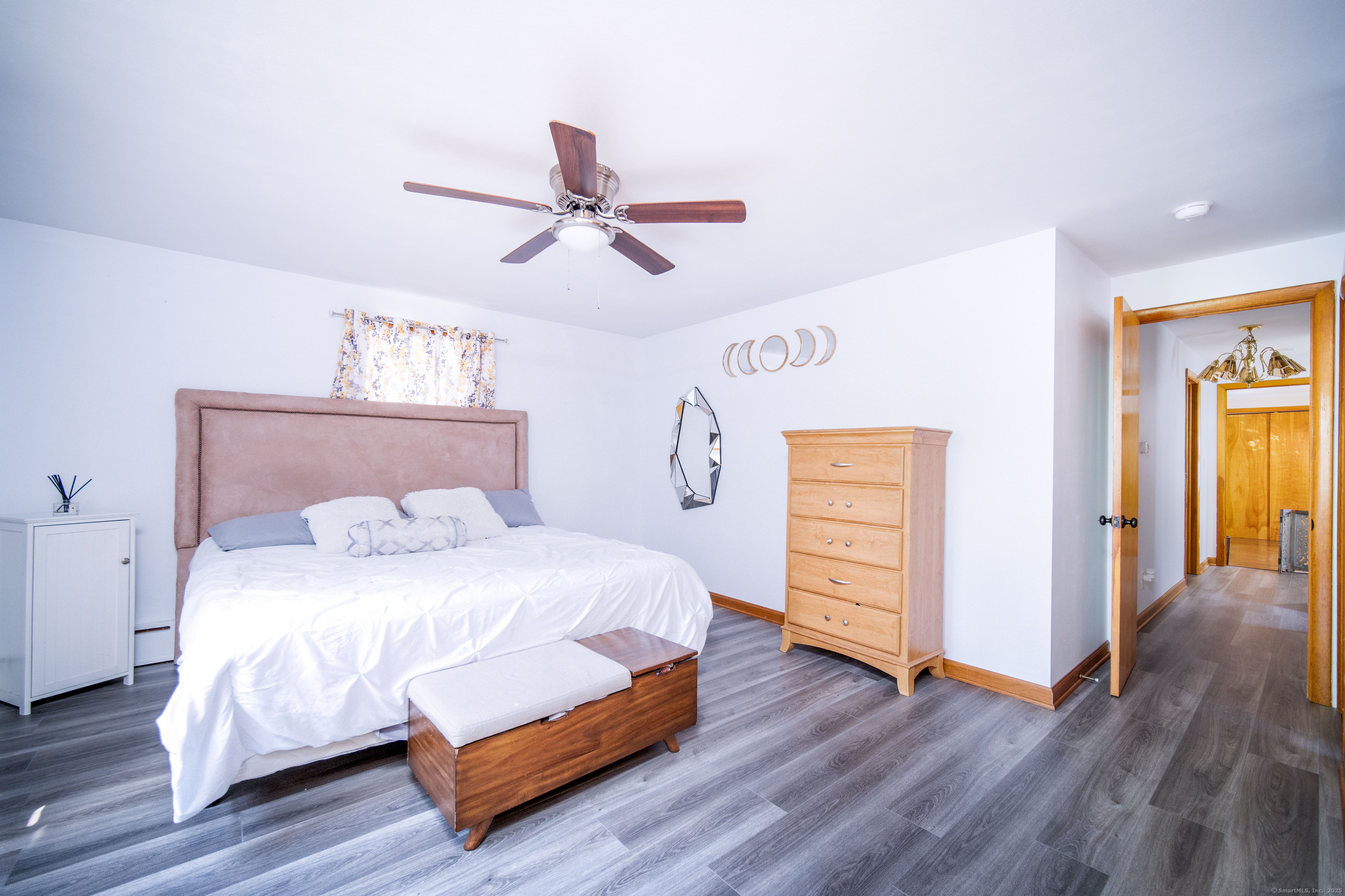 147 Funston Avenue Torrington, CT 06790 - Photo 14 of 40 a bedroom with a bed and wooden floor