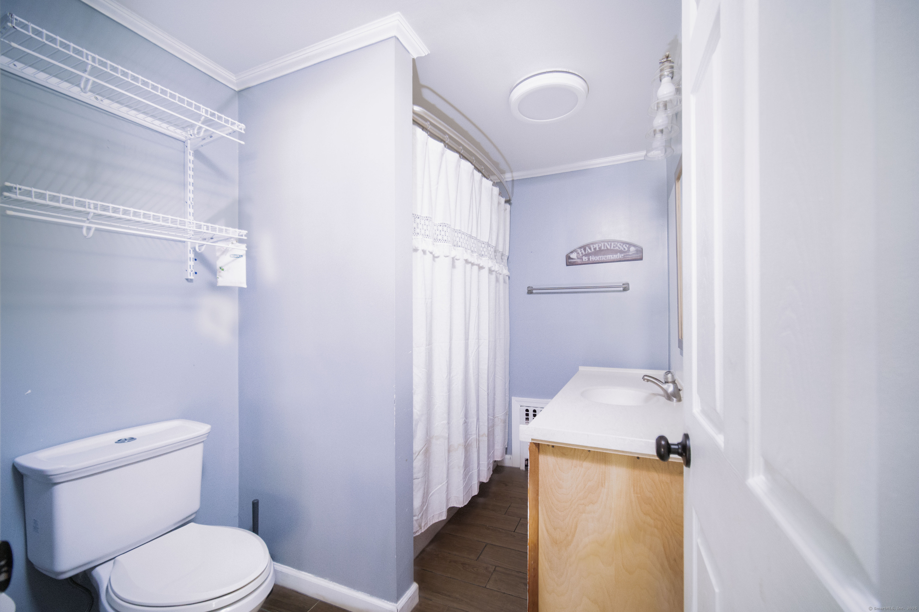 147 Funston Avenue Torrington, CT 06790 - Photo 16 of 40 a bathroom with a granite countertop toilet and a sink