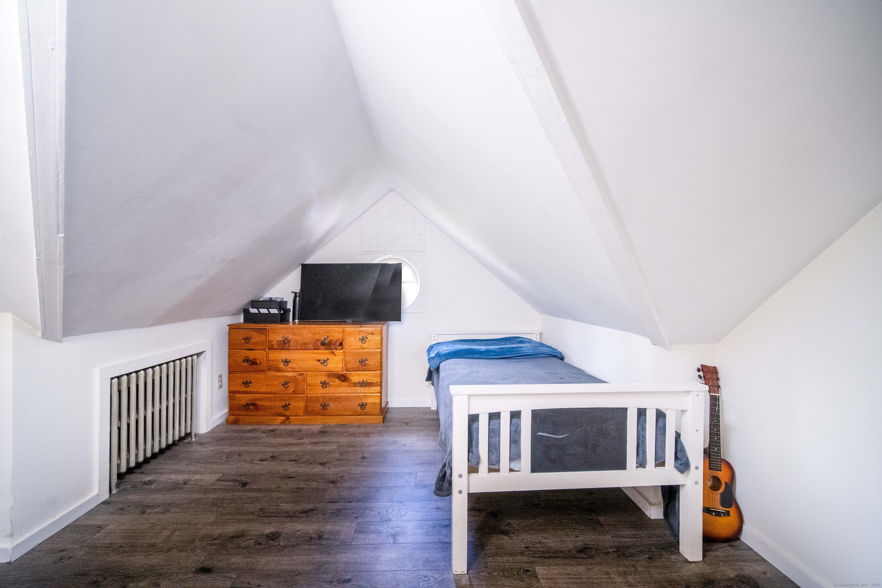 147 Funston Avenue Torrington, CT 06790 - Photo 25 of 40 a bedroom with furniture and wooden floor