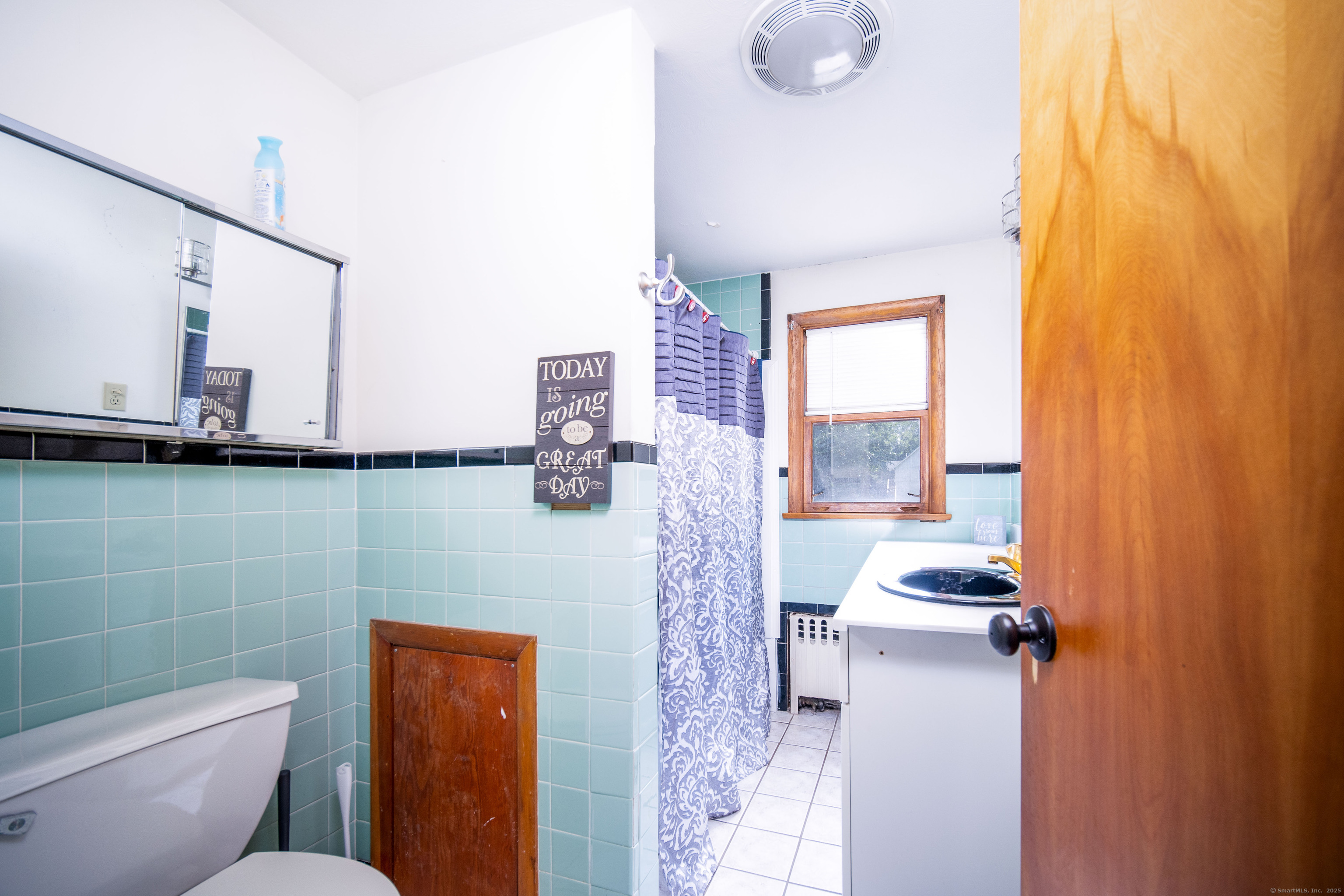 147 Funston Avenue Torrington, CT 06790 - Photo 26 of 40 a bathroom with a toilet sink and mirror