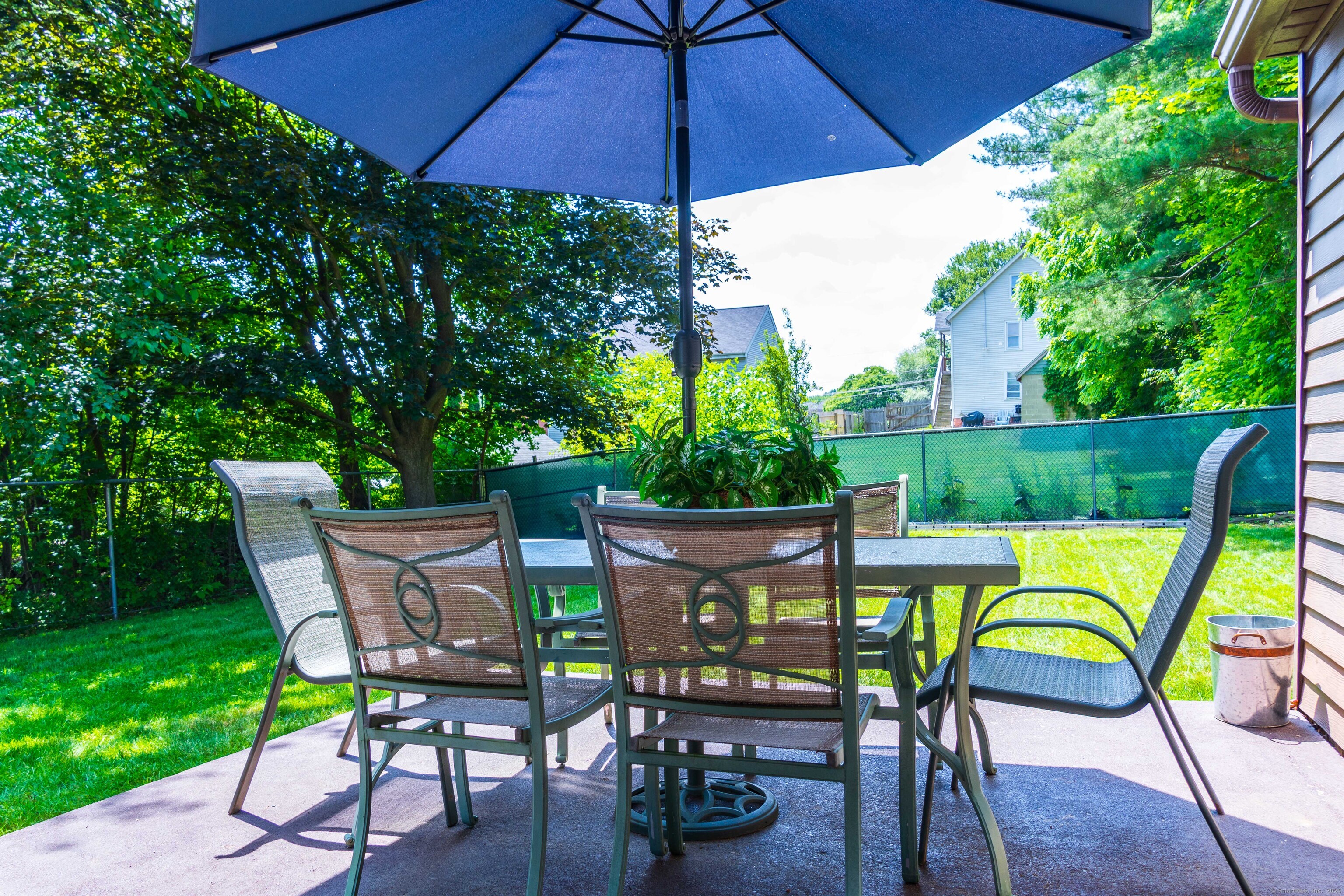 147 Funston Avenue Torrington, CT 06790 - Photo 39 of 40 an outdoor sitting area with furniture and umbrella