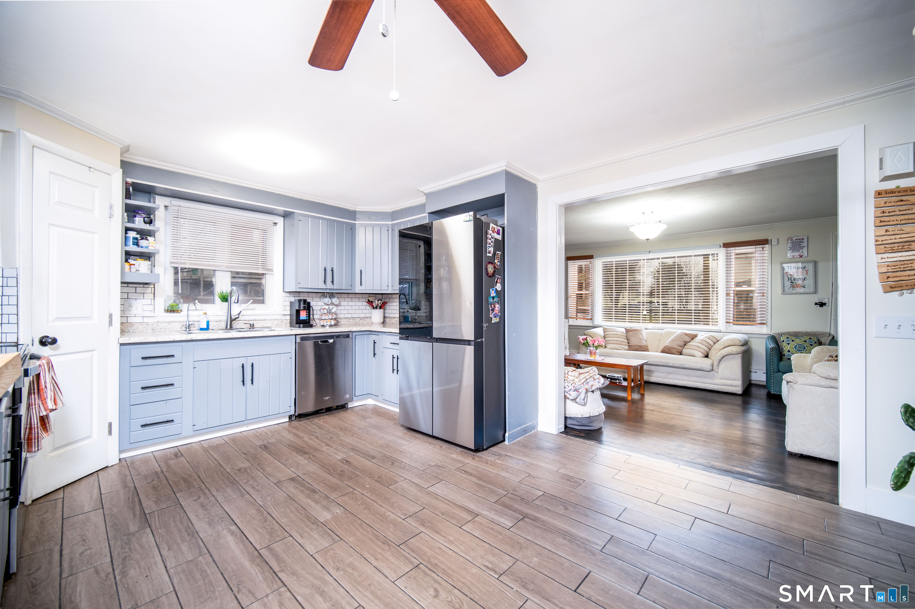 147 Funston Avenue Torrington, CT 06790 - Photo 7 of 40 a kitchen with furniture a refrigerator and a view of living room
