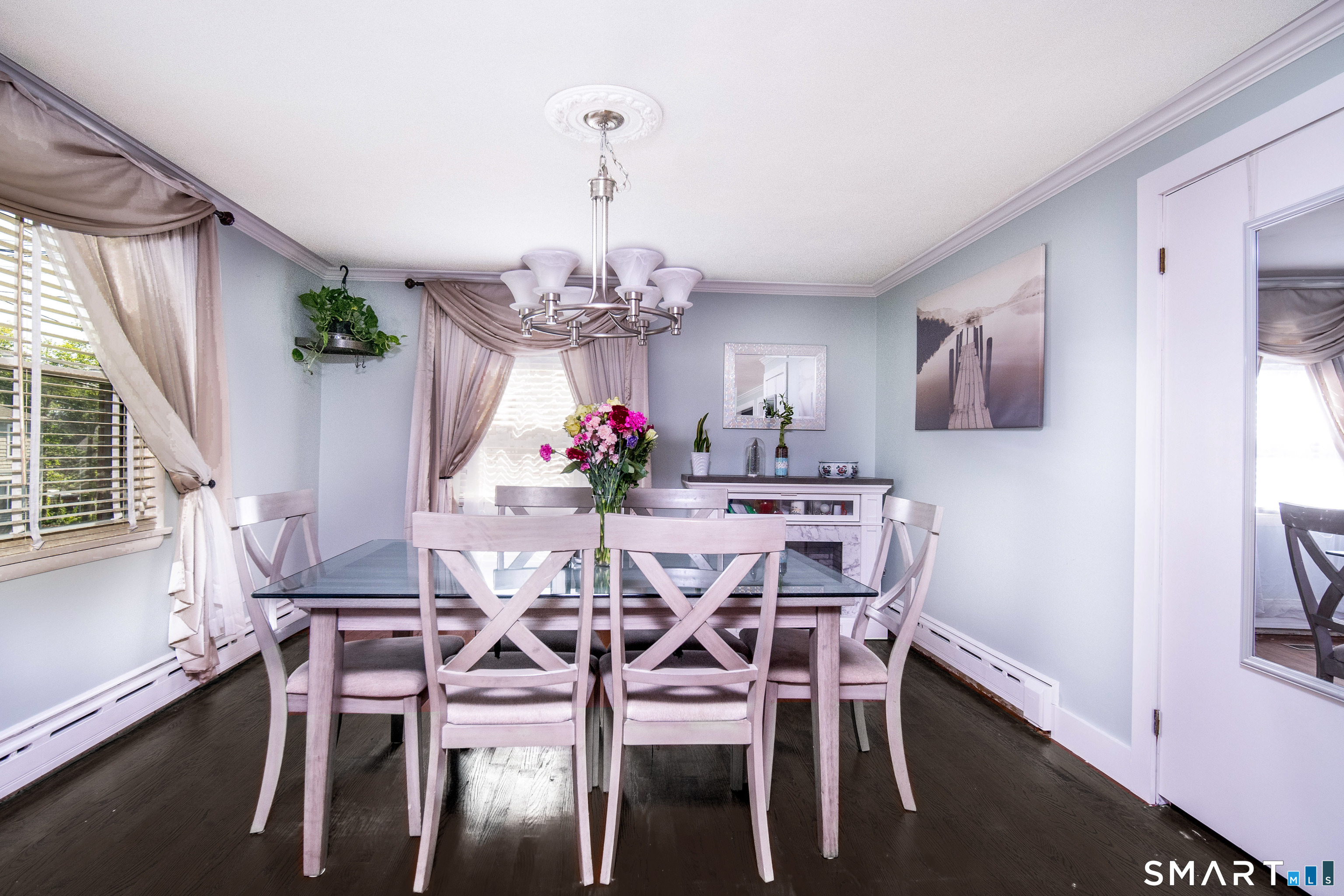147 Funston Avenue Torrington, CT 06790 - Photo 9 of 40 a view of a dining room with furniture a chandelier and wooden floor