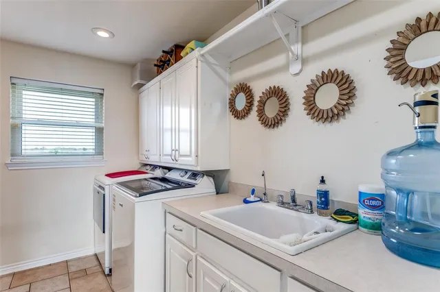 a bathroom with a sink a vanity and a window