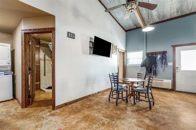 a dining room with furniture and wooden floor