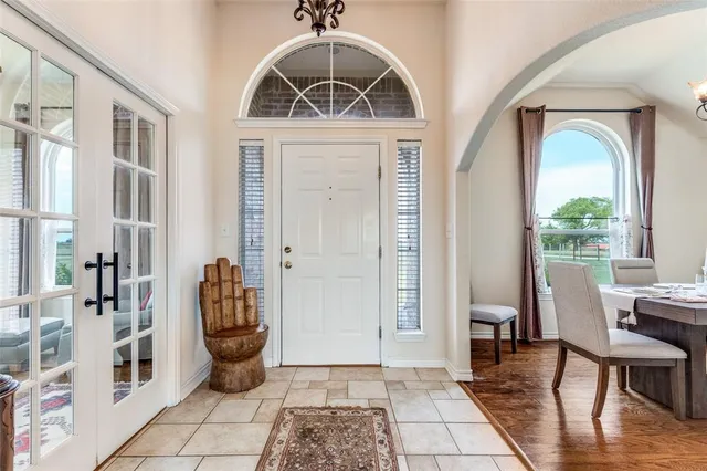 a view of a livingroom with furniture and front door