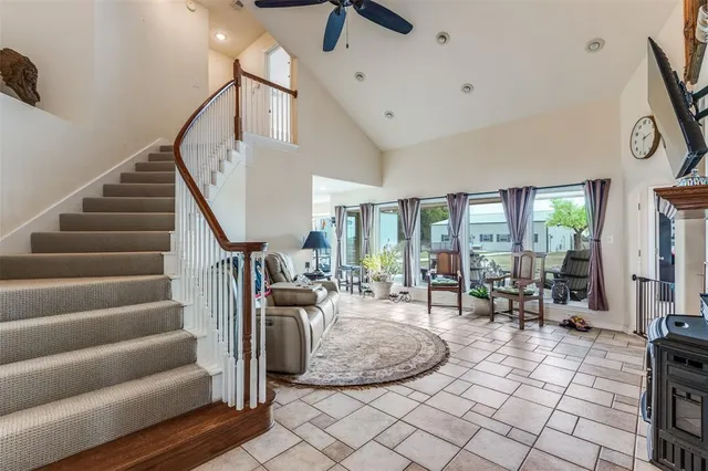 a view of a livingroom with furniture and floor to ceiling window