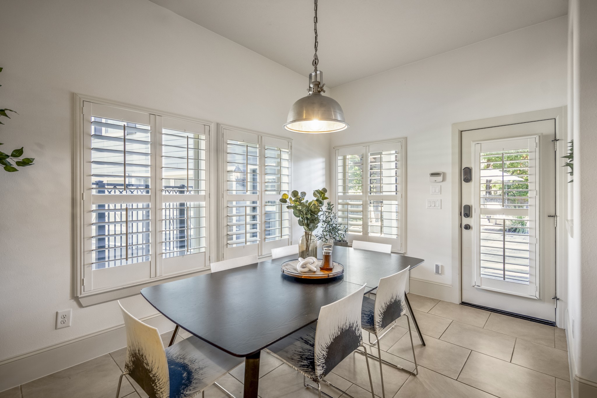 3710 Snowden Point Lane Spring, TX 77386 - Photo 16 of 50 Bright & spacious breakfast area with large windows featuring plantation shutters, modern pendant light, and access to your outdoor oasis & garage guest suite.