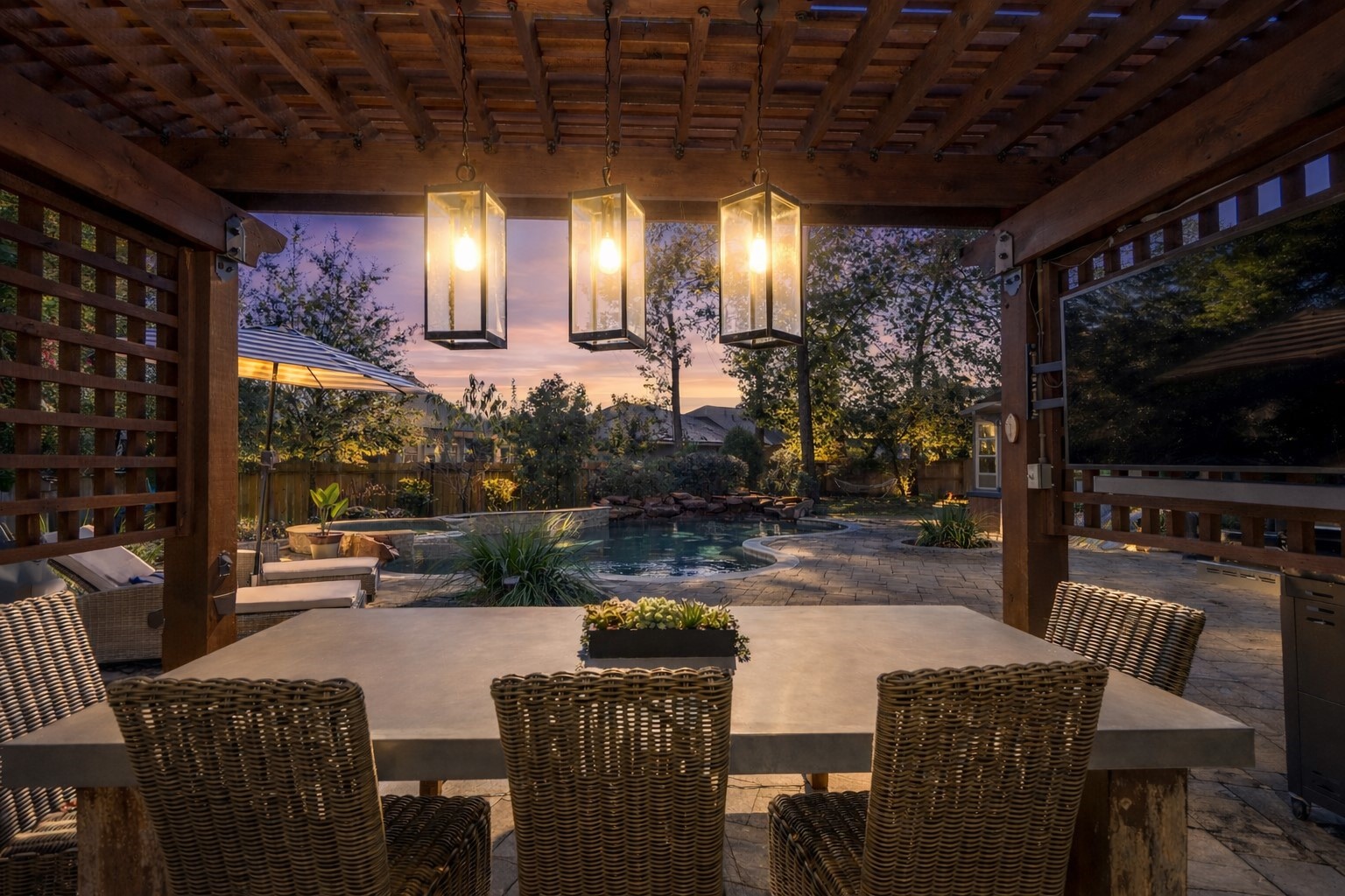 3710 Snowden Point Lane Spring, TX 77386 - Photo 2 of 50 This outdoor space features a cozy pergola with hanging lanterns over a stylish dining area, offering a view of a tranquil pool surrounded by lush landscaping, and if you look close, you'll see the hammock too!