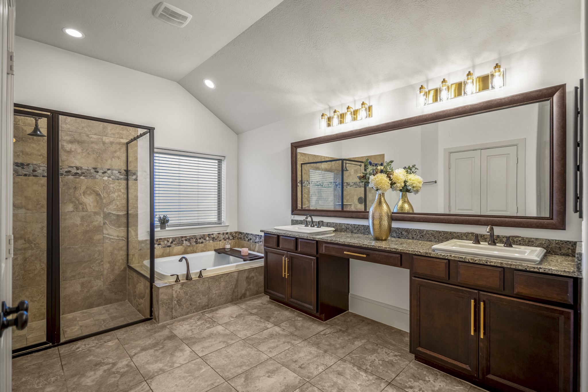 3710 Snowden Point Lane Spring, TX 77386 - Photo 21 of 50 The primary bath also includes a large walk-in shower, elegant bathtub and plentiful space to get ready for the day!