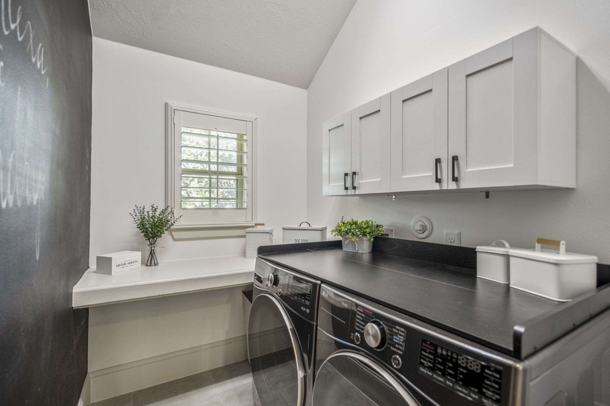 3710 Snowden Point Lane Spring, TX 77386 - Photo 29 of 50 An updated laundry room adds modern function and style, with a window providing natural light and additional storage inlcuded.
