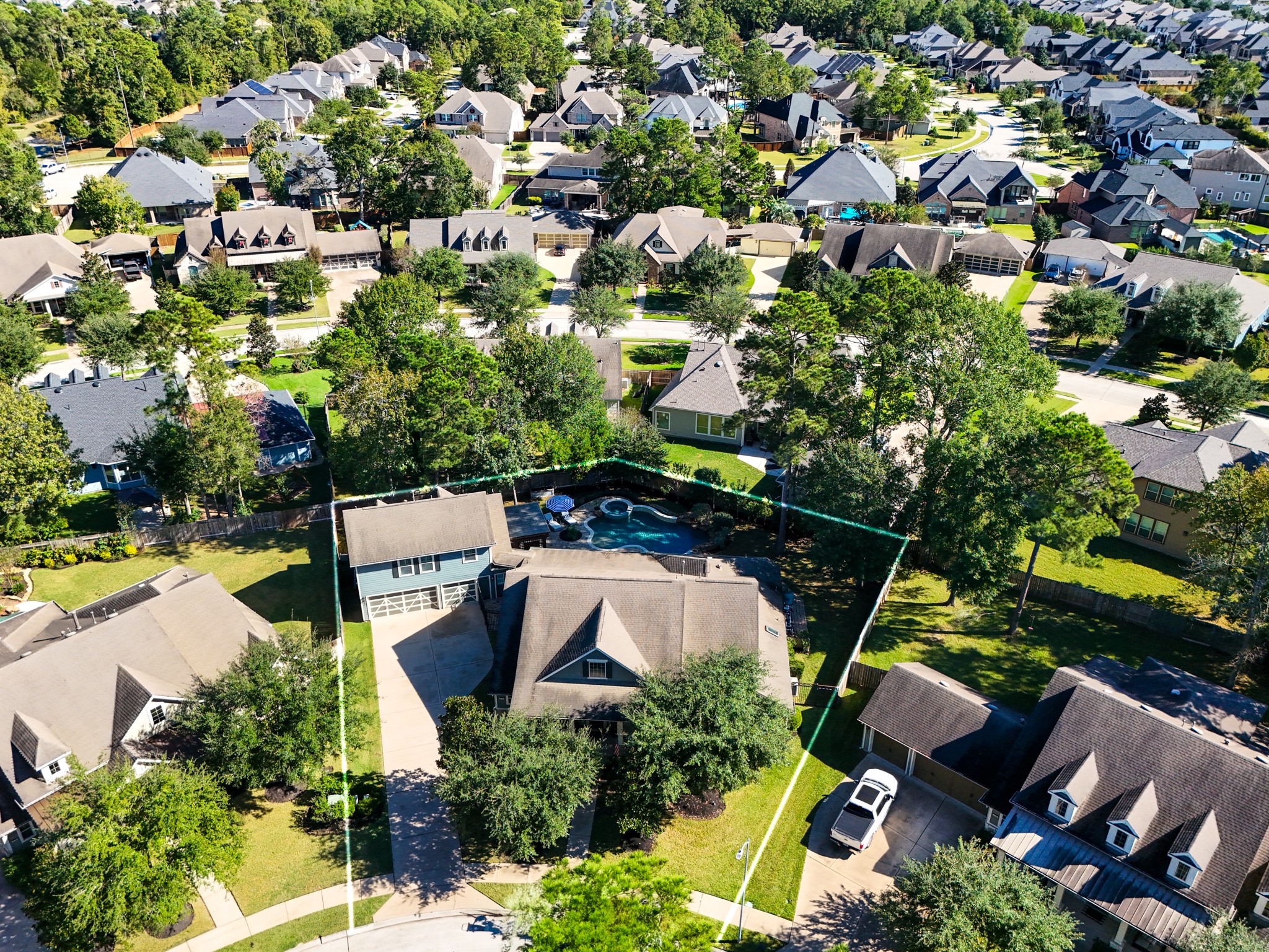 3710 Snowden Point Lane Spring, TX 77386 - Photo 6 of 50 This aerial photo showcases this spacious home with a large backyard featuring a pool, surrounded by mature trees in The Falls of Imperial Oaks, a well-maintained neighborhood. The property is located on a quiet cul-de-sac, offering privacy and ample space.