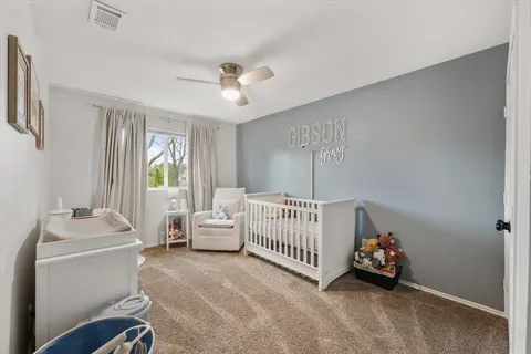 a bedroom with furniture and a window