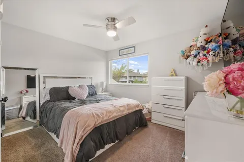 a bedroom with two beds and a dresser
