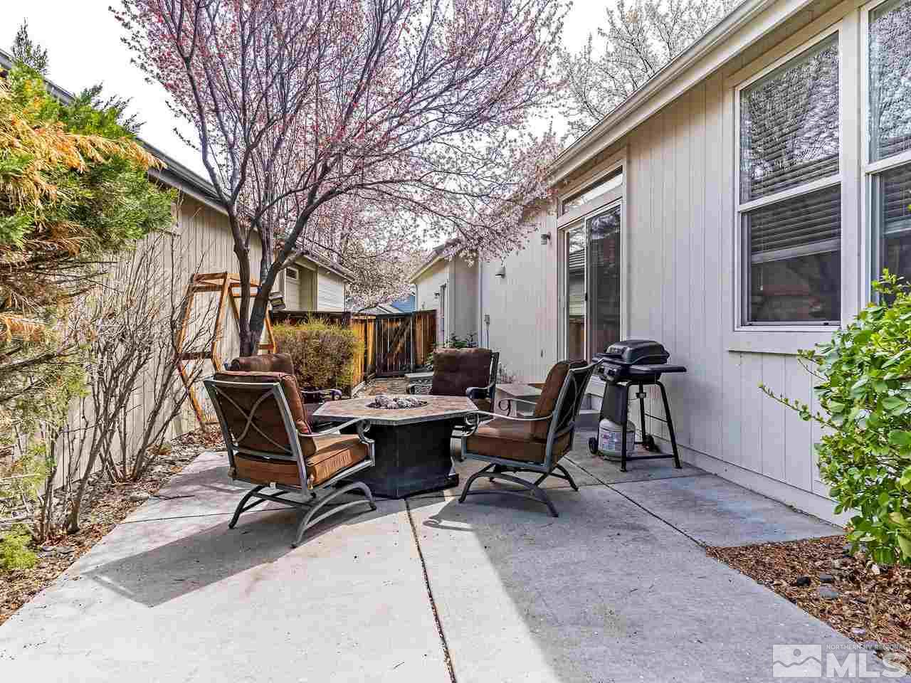 875 Caughlin Crossing Reno, NV 89519 - Photo 17 of 21 a view of a dinning tables and chairs in backyard of the house