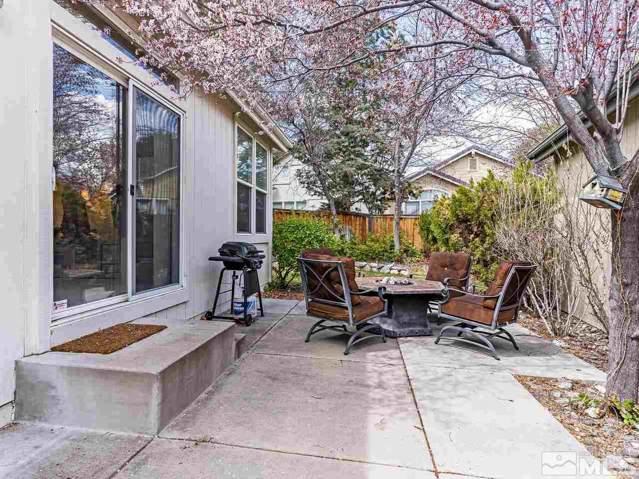 875 Caughlin Crossing Reno, NV 89519 - Photo 18 of 21 a view of backyard with sitting area and furniture