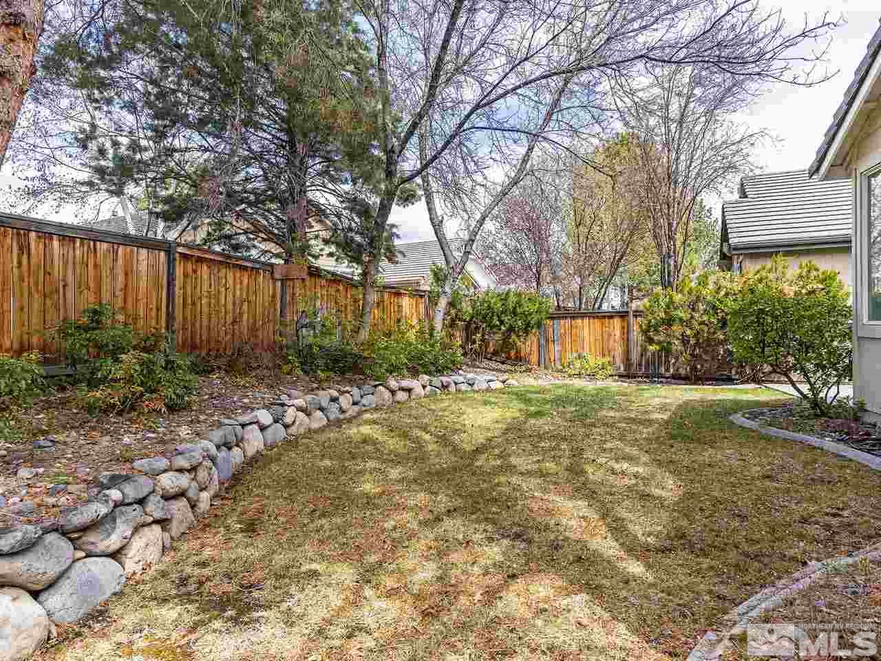 875 Caughlin Crossing Reno, NV 89519 - Photo 20 of 21 a view of backyard of house with green space