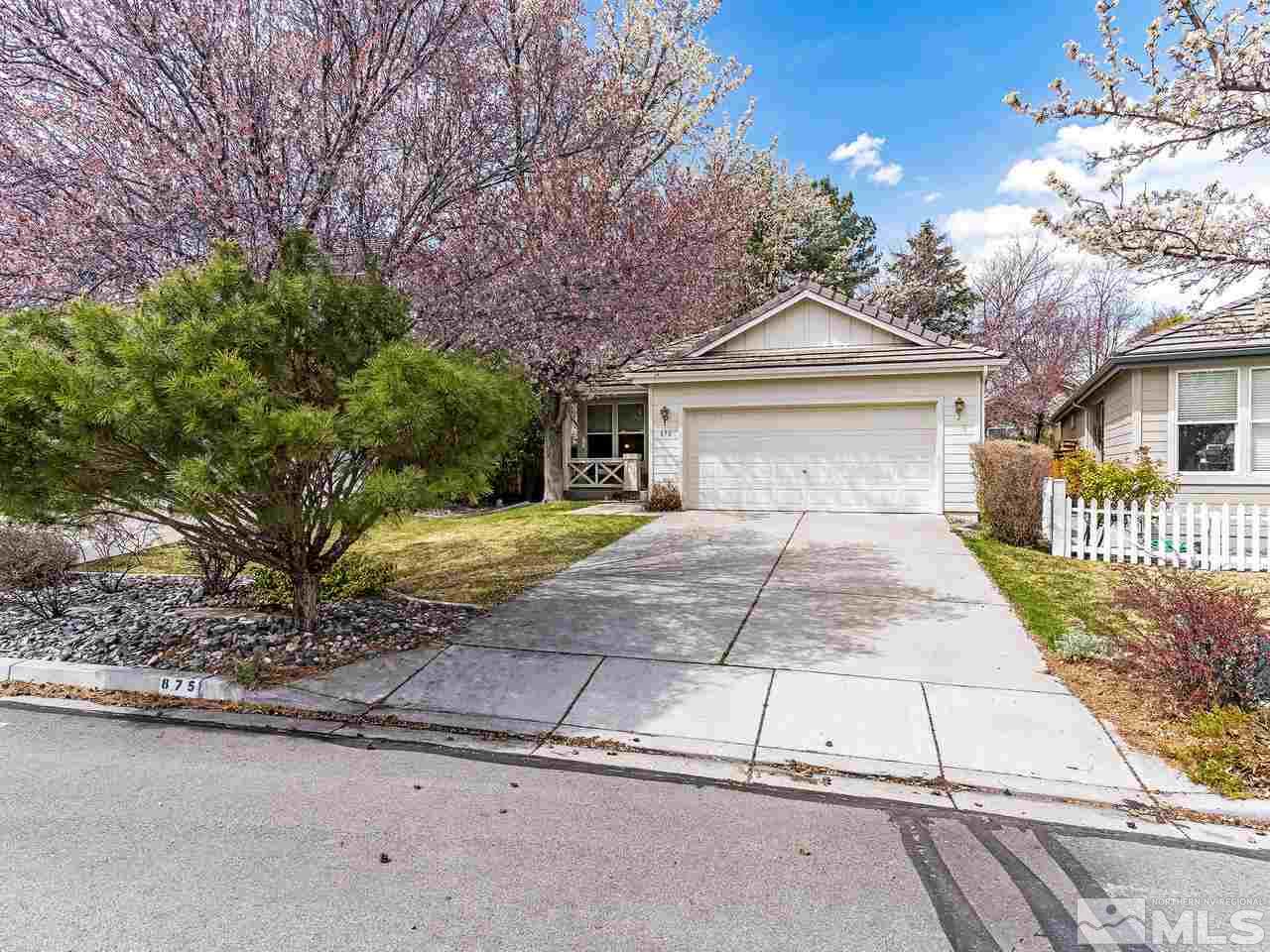 875 Caughlin Crossing Reno, NV 89519 - Photo 3 of 21 a front view of a house with a yard and potted plants