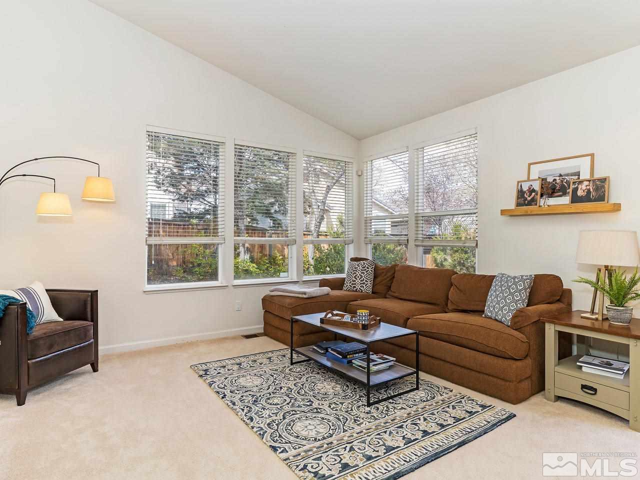 875 Caughlin Crossing Reno, NV 89519 - Photo 5 of 21 a living room with furniture and a window
