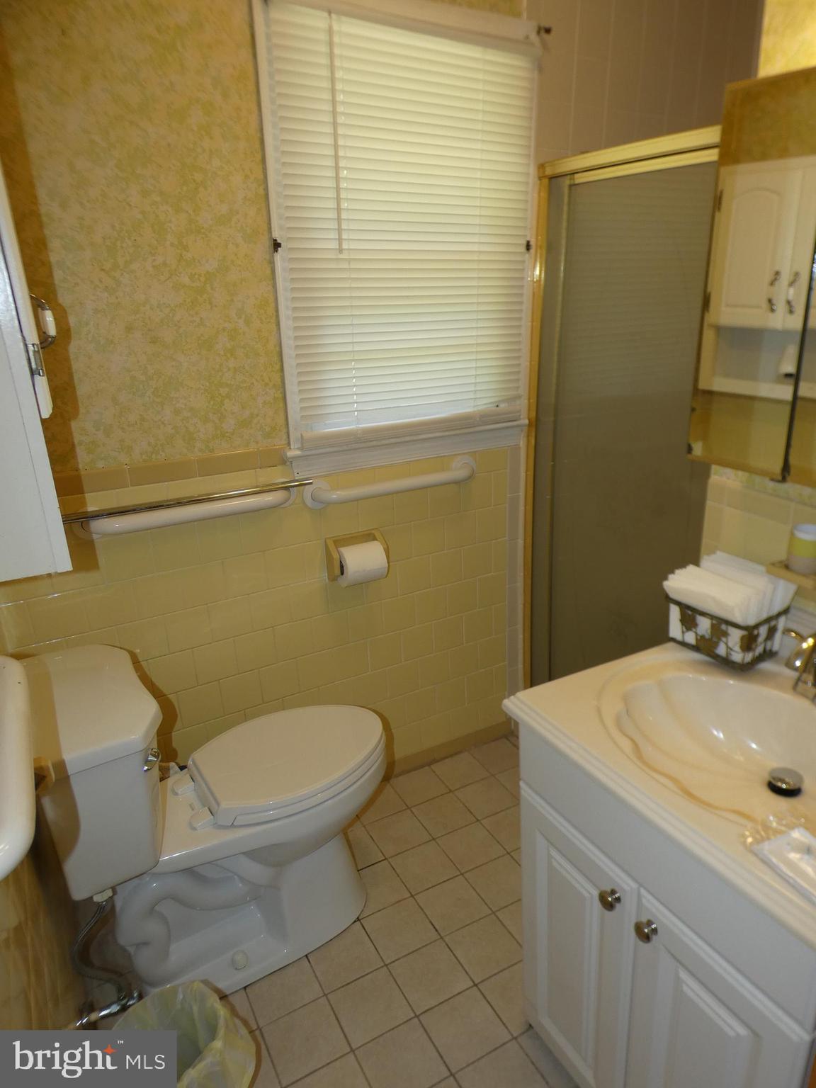9517 Brock Road Spotsylvania, VA 22553 - Photo 14 of 27 a bathroom with a sink and a toilet