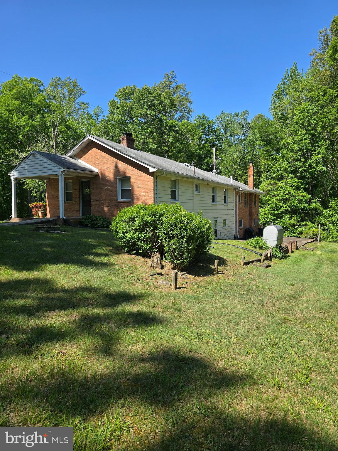 9517 Brock Road Spotsylvania, VA 22553 - Photo 19 of 27 a backyard of a house with lots of green space