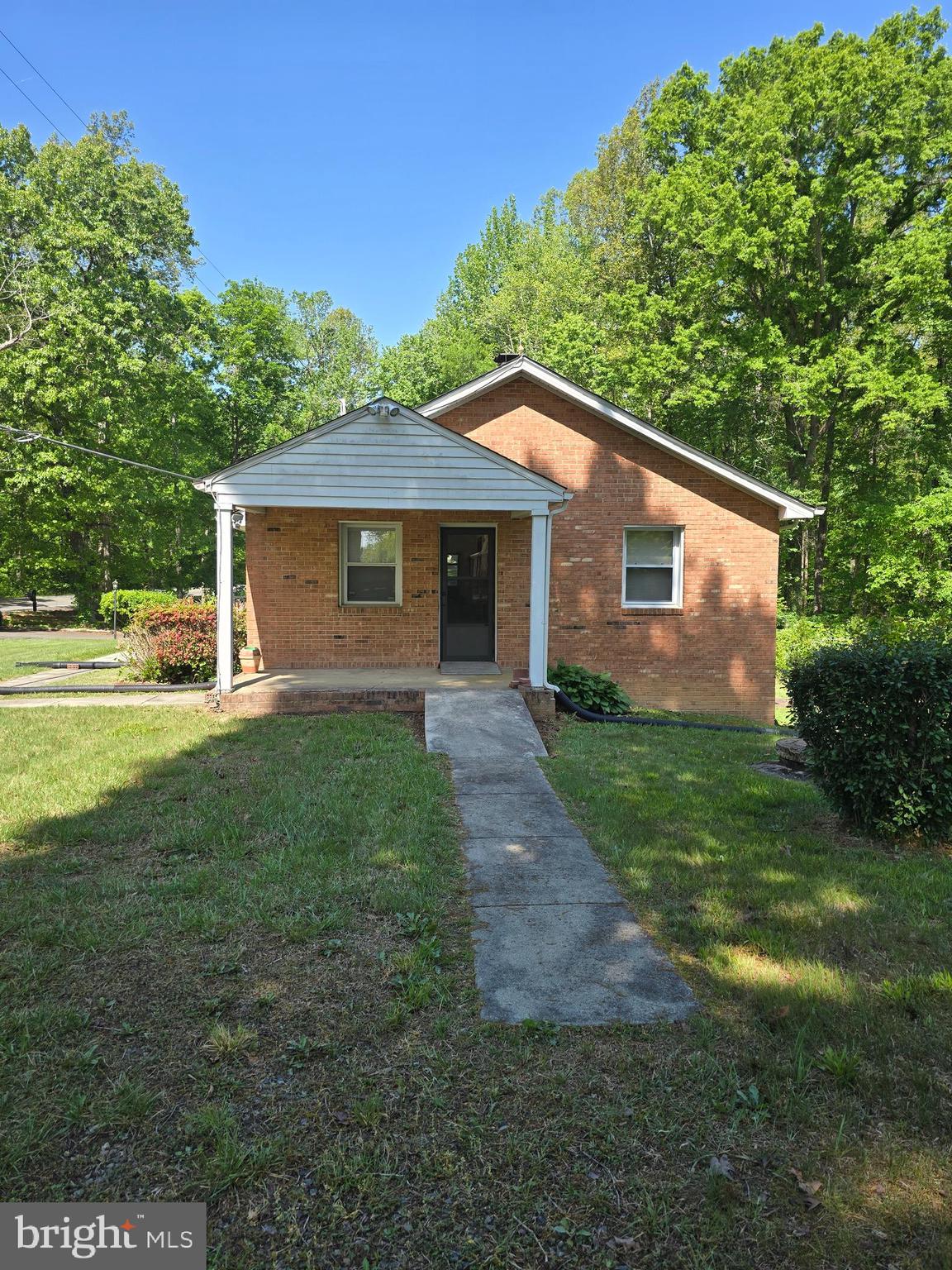 9517 Brock Road Spotsylvania, VA 22553 - Photo 20 of 27 a front view of house with yard and green space