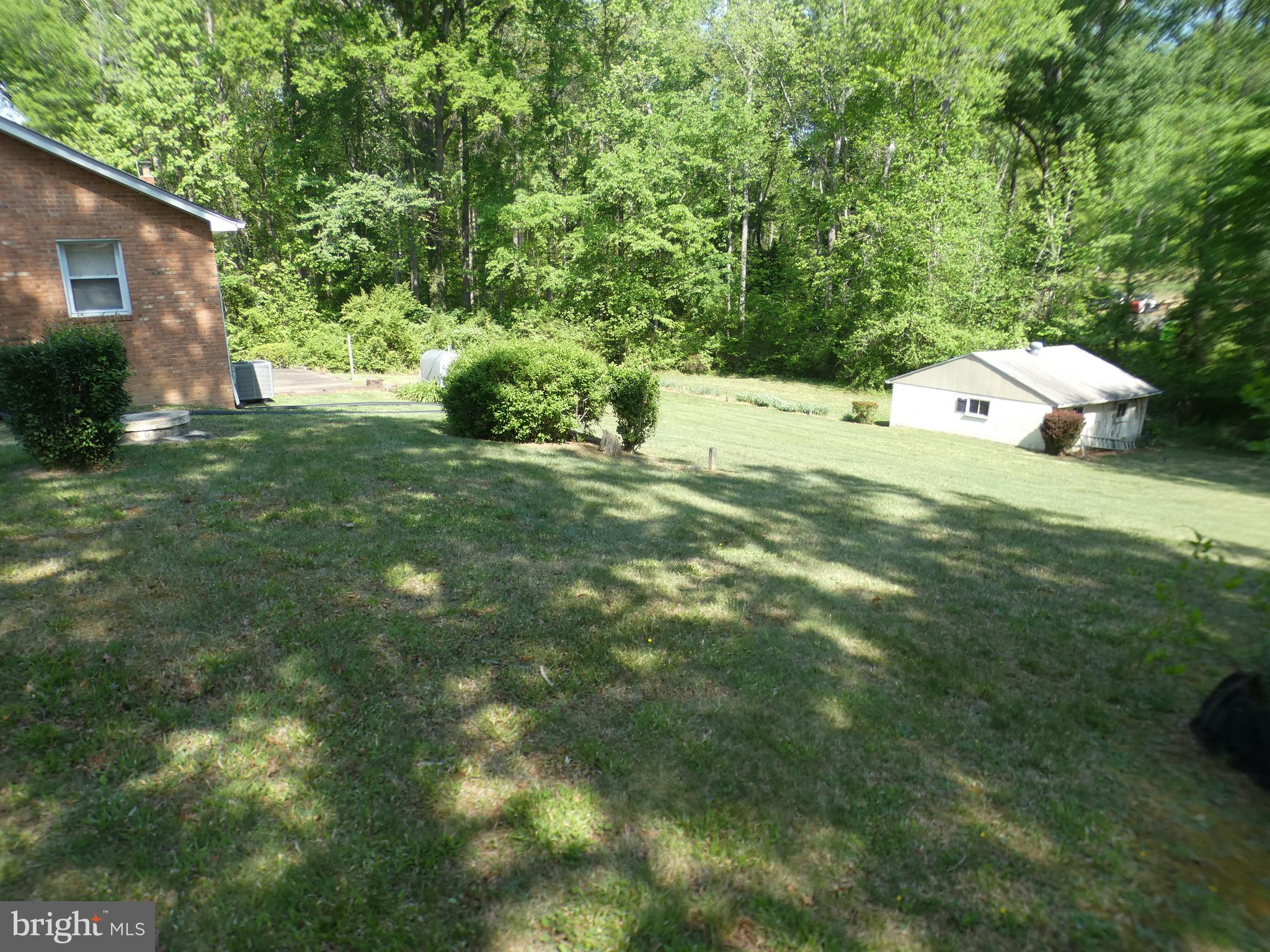 9517 Brock Road Spotsylvania, VA 22553 - Photo 24 of 27 a backyard of a house with lots of green space
