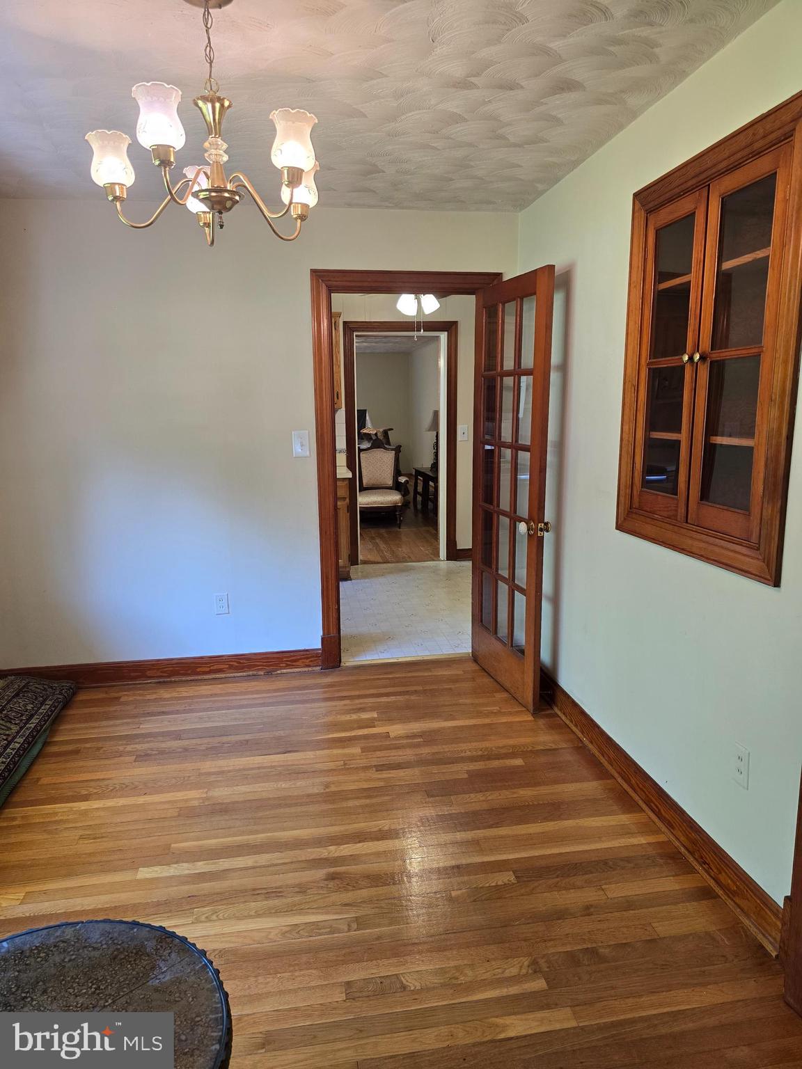 9517 Brock Road Spotsylvania, VA 22553 - Photo 6 of 27 a view of a livingroom with a chandelier