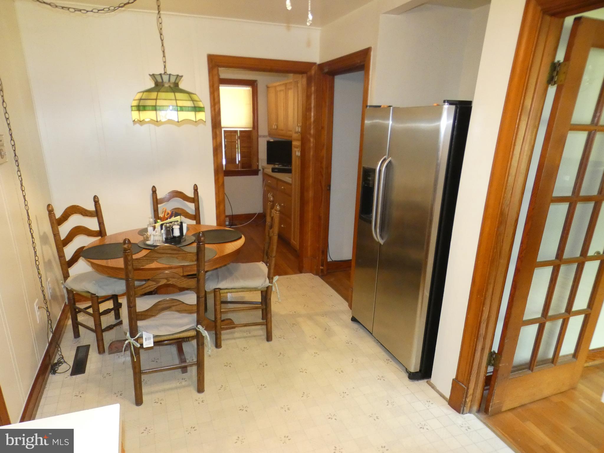 9517 Brock Road Spotsylvania, VA 22553 - Photo 7 of 27 a dining room with furniture and a window