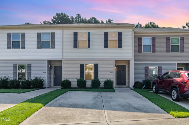 a picture of a bench in front of a wall