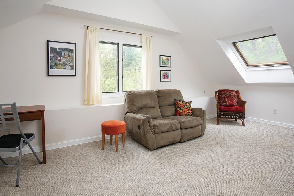 50 Undine Road, Unit 5 Brighton, MA 02135 - Photo 6 of 11 a living room with furniture and a window
