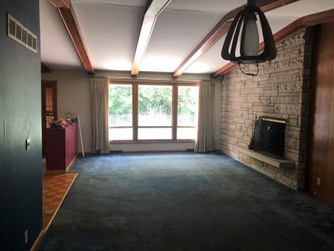 1600 Middletree Road Joliet, IL 60433 - Photo 13 of 22 an empty room with windows dryer and fireplace