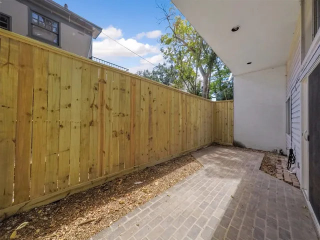 a view of a backyard of the house