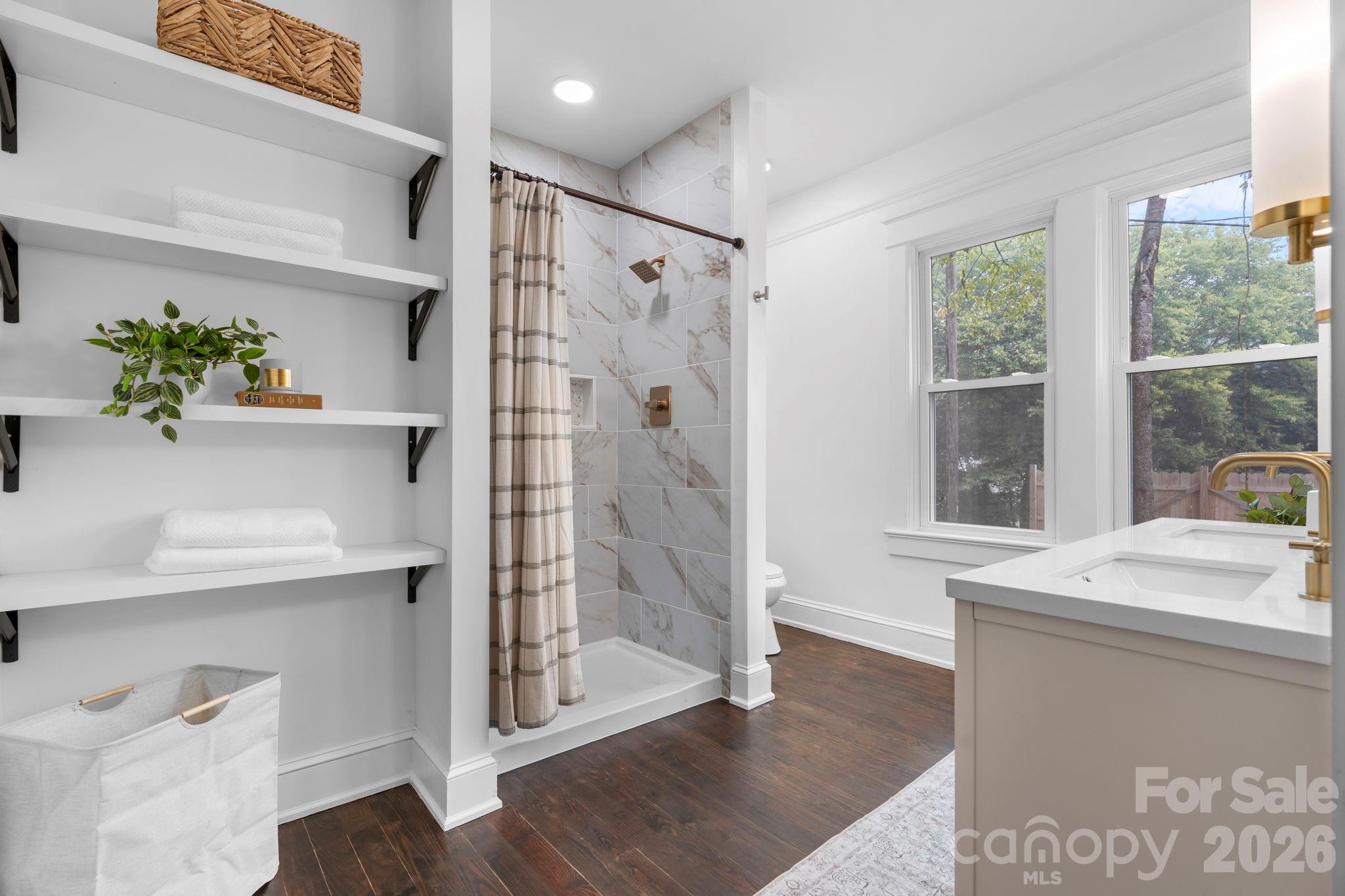 1590 South Center Street Hickory, NC 28602 - Photo 13 of 29 a bathroom with a shower sink and mirror