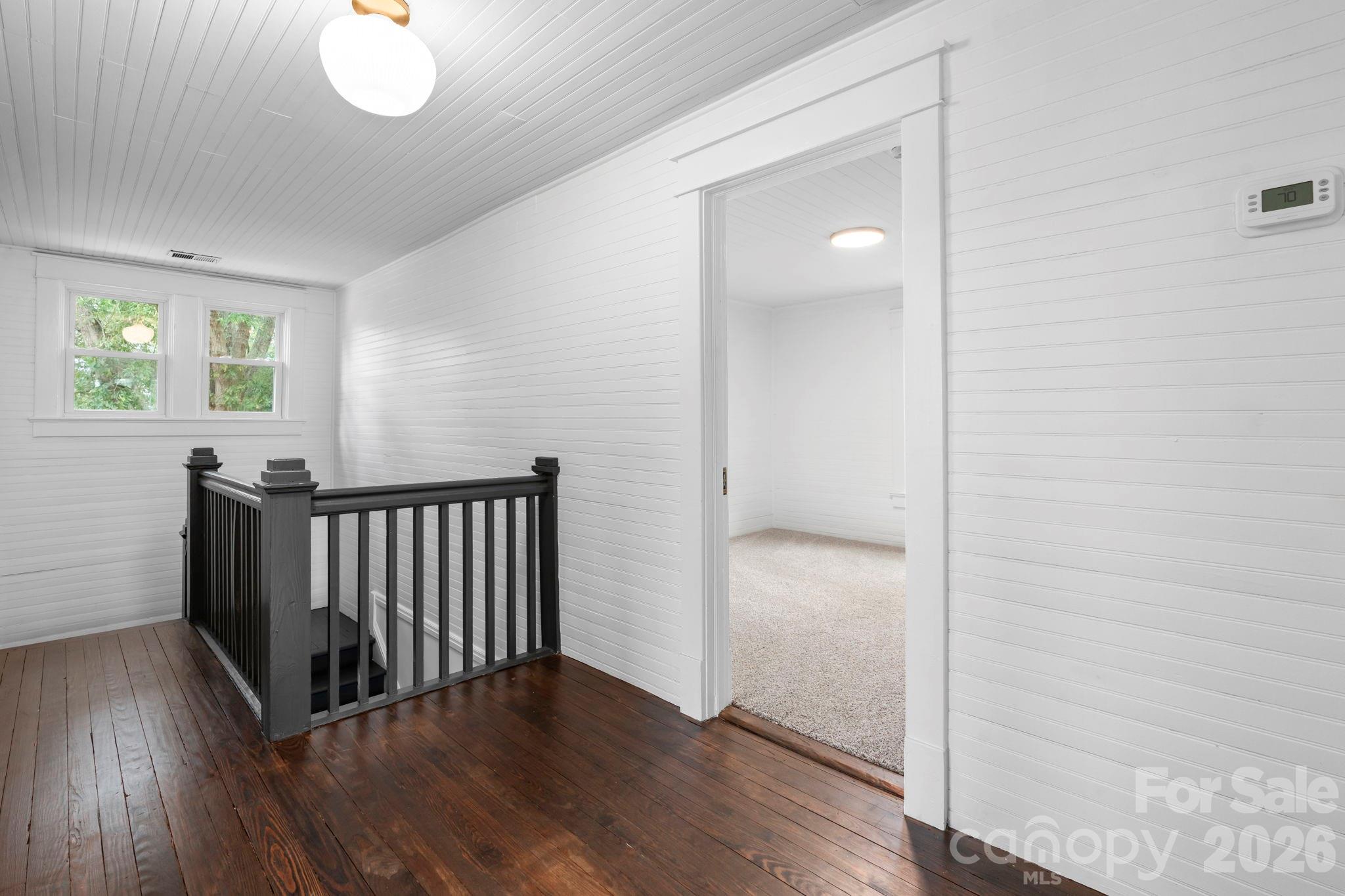 1590 South Center Street Hickory, NC 28602 - Photo 16 of 29 a view of a room with wooden floor and windows