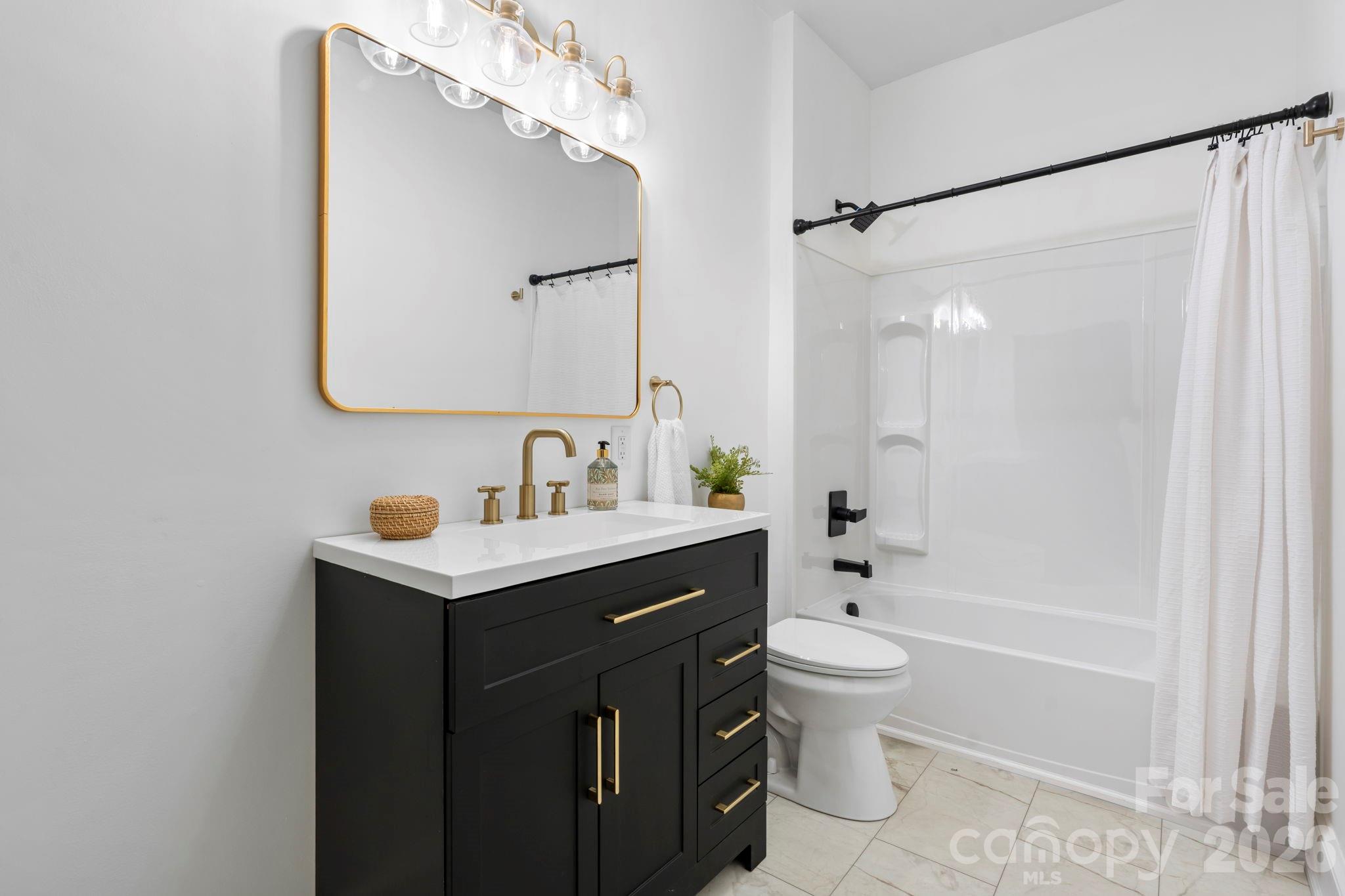 1590 South Center Street Hickory, NC 28602 - Photo 19 of 29 a bathroom with a sink a toilet and shower