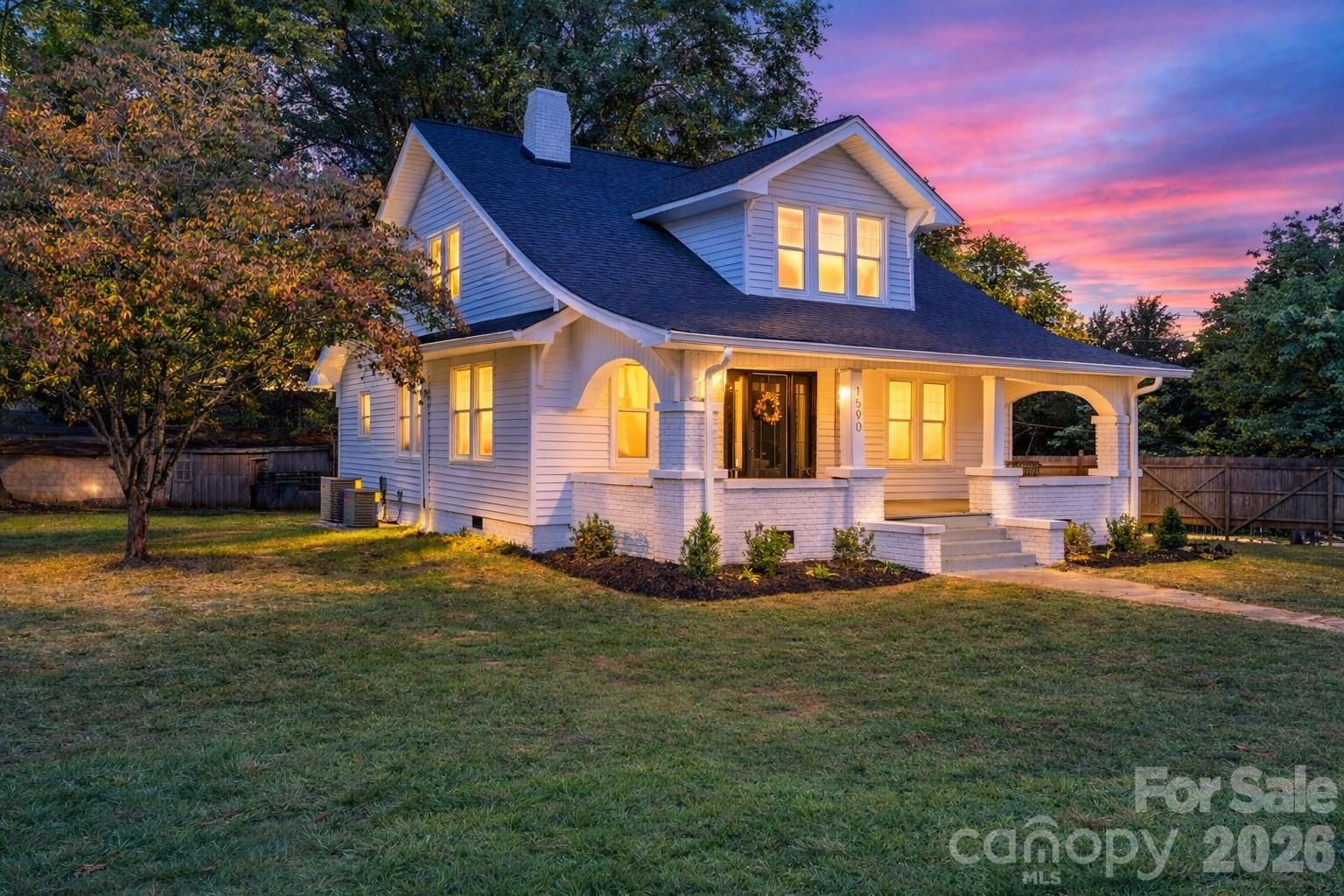 1590 South Center Street Hickory, NC 28602 - Photo 26 of 29 a front view of a house with a yard