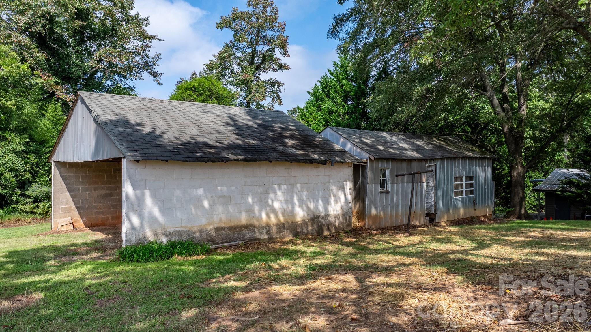 1590 South Center Street Hickory, NC 28602 - Photo 28 of 29 a backyard of a house with lots of green space