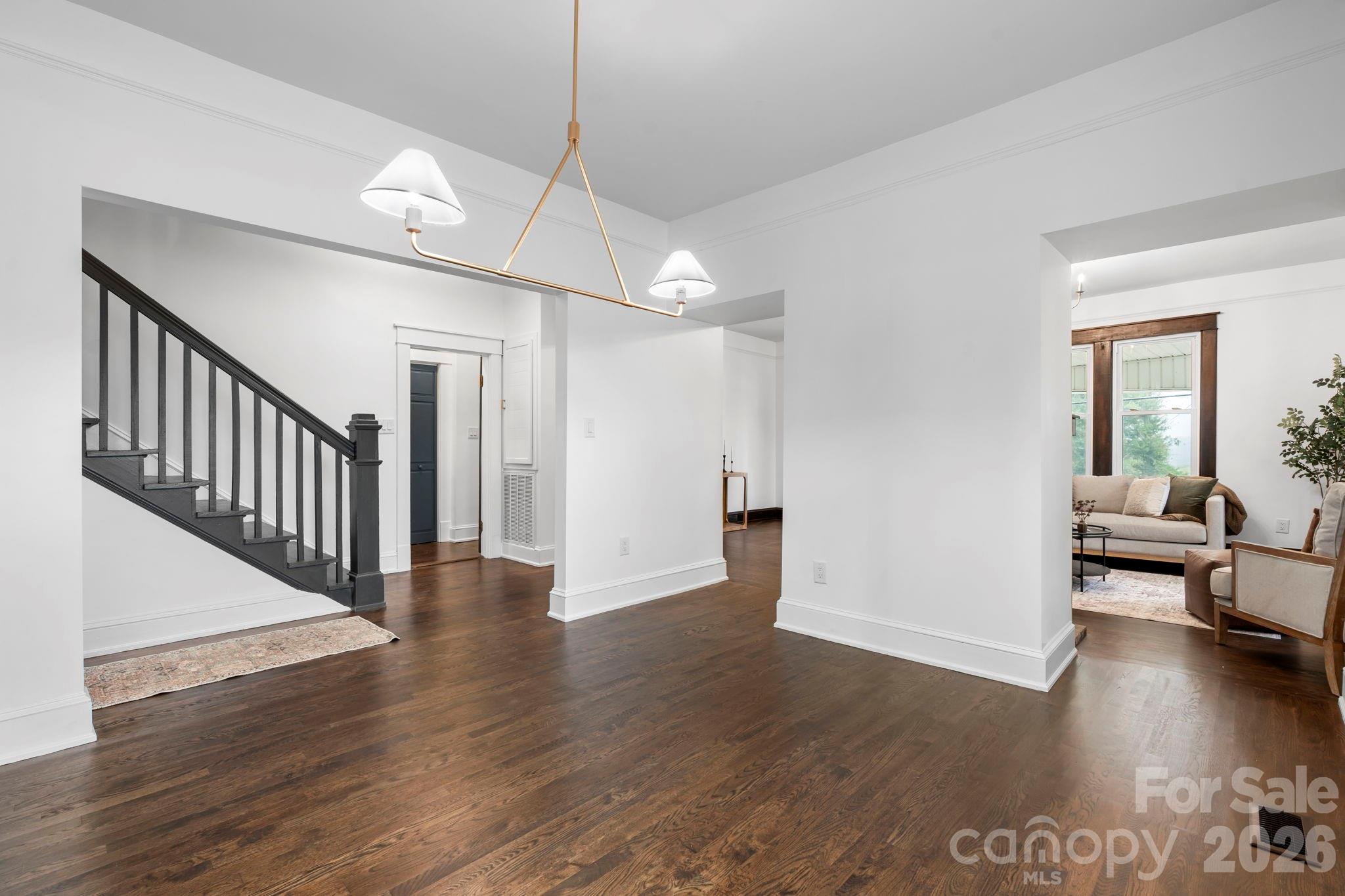 1590 South Center Street Hickory, NC 28602 - Photo 10 of 29 a view of a livingroom with wooden floor and a ceiling fan