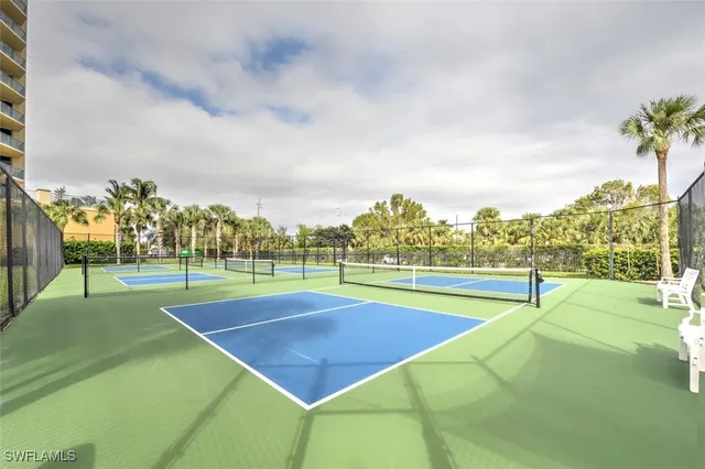 a view of an outdoor space and basketball court