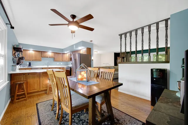a workspace with stainless steel appliances kitchen island granite countertop furniture