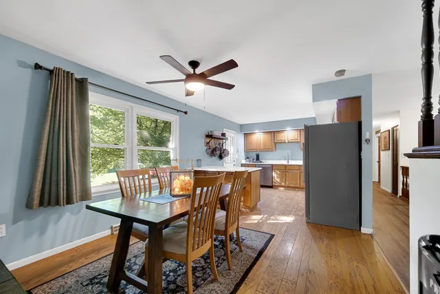 a view of a dining room with furniture window and outside view