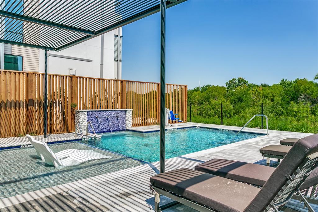 1111 Raiford Road, Unit 100 Carrollton, TX 75007 - Photo 28 of 33 Private community pool overlooking the scenic blue trail and greenbelt, creating a tranquil setting for relaxation.
