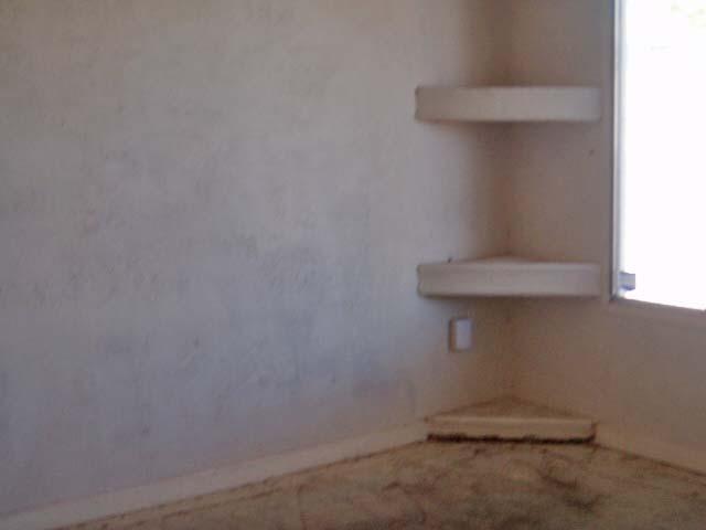 5215 West Berkeley Road Phoenix, AZ 85035 - Photo 3 of 7 Corner Shelves in Livingroom
