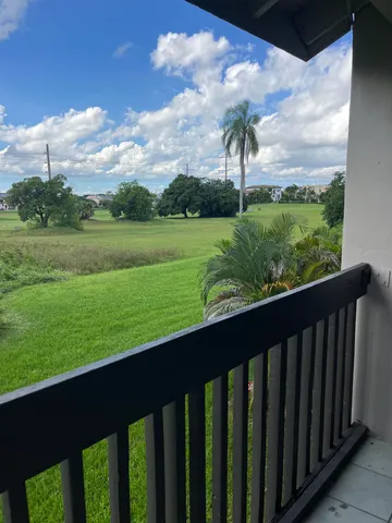 a white toilet sitting next to a white sink
