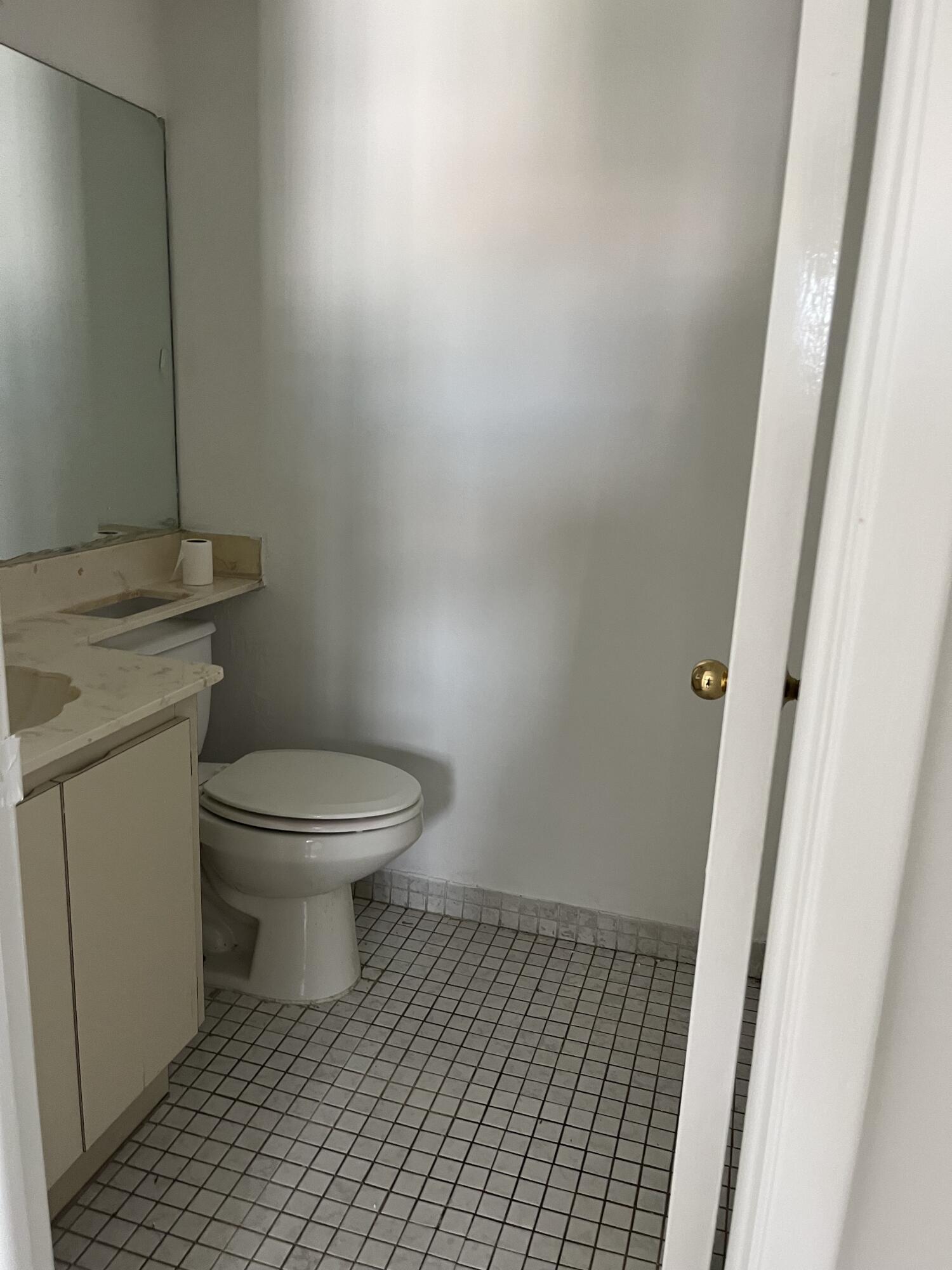 8879 Fontainebleau Boulevard, Unit 206 Miami, FL 33172 - Photo 4 of 7 a white toilet sitting next to a white sink