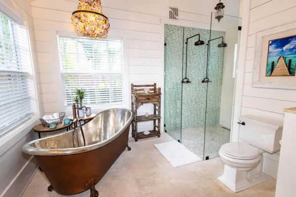 a bathroom with a bathtub and a toilet