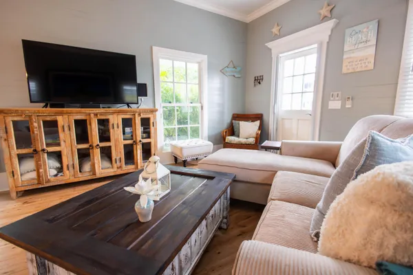 a living room with furniture and a flat screen tv