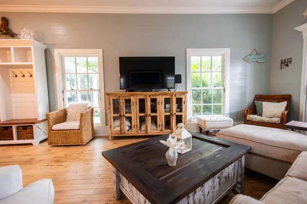 a living room with furniture and a flat screen tv