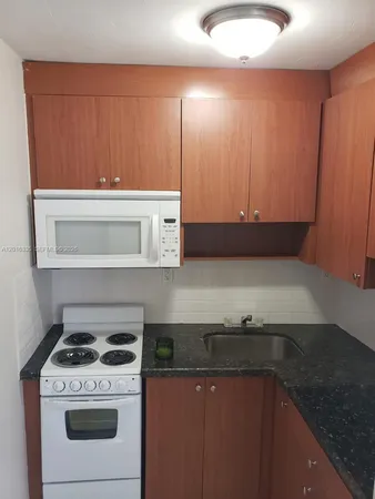 a kitchen with a stove and a sink
